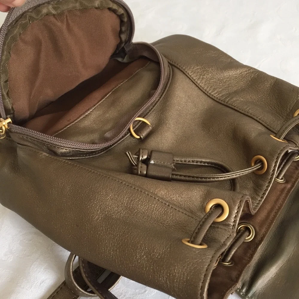 Gold bronze leather backpack